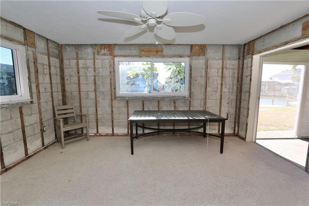 Sitting room featuring healthy amount of natural light and ceiling fan