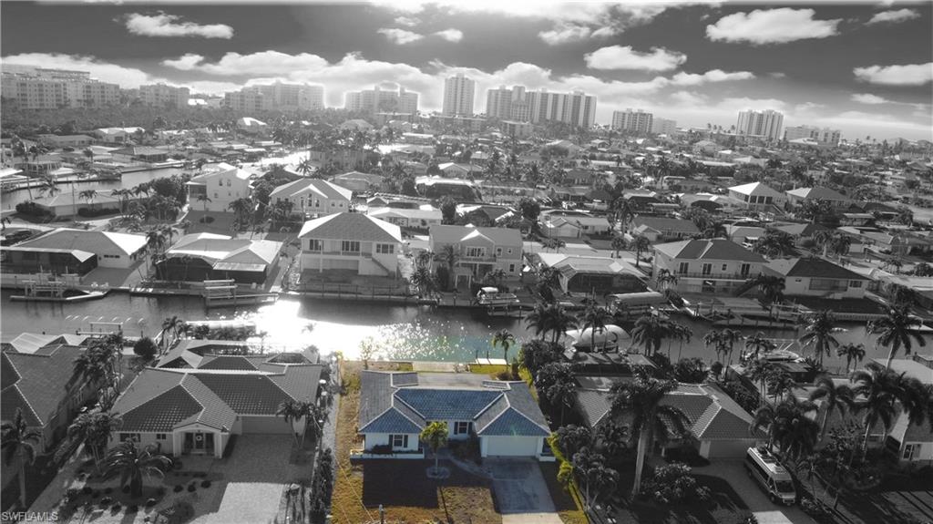 View of urban area featuring a nearby body of water and nearby suburban area