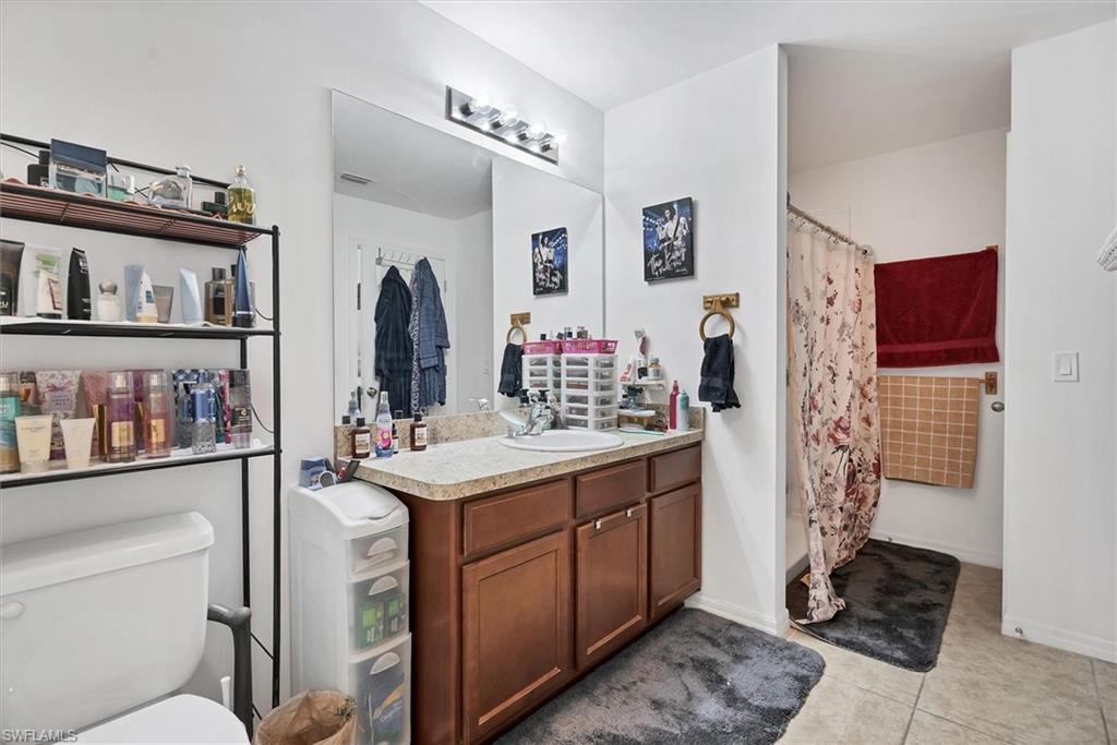Bathroom with vanity and light tile patterned floors