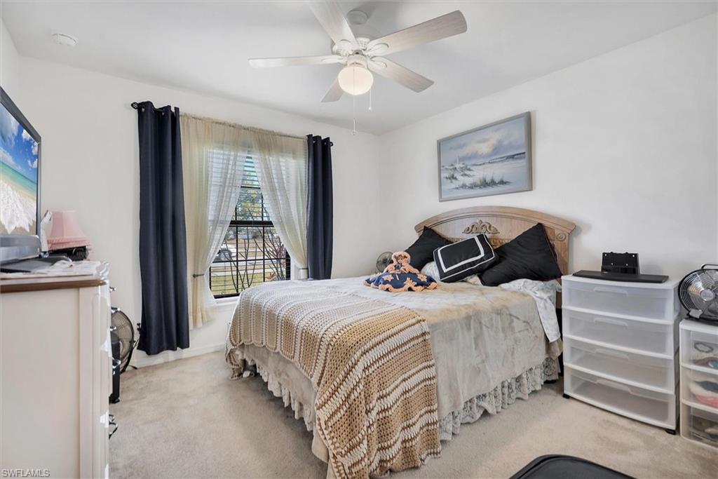 Bedroom featuring carpet floors and a ceiling fan