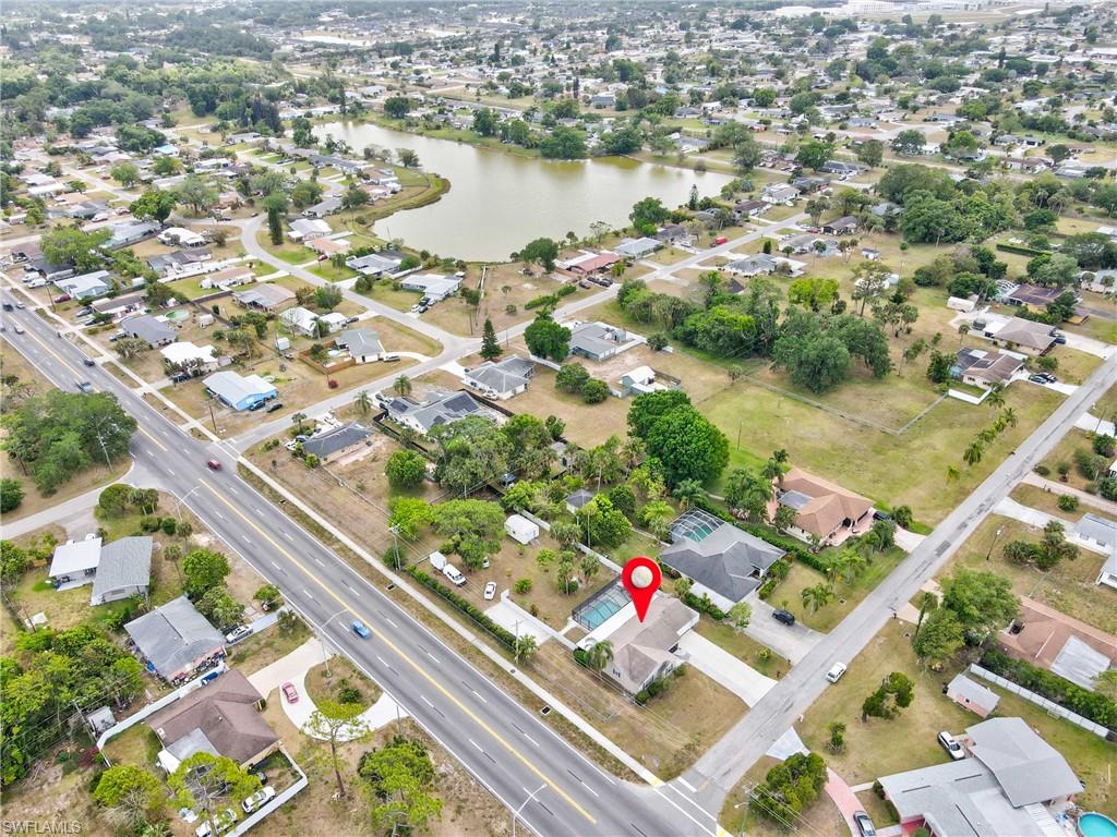Aerial overview of property's location with nearby suburban area and a large body of water