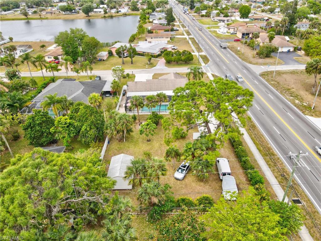 Aerial view of residential area featuring a large body of water