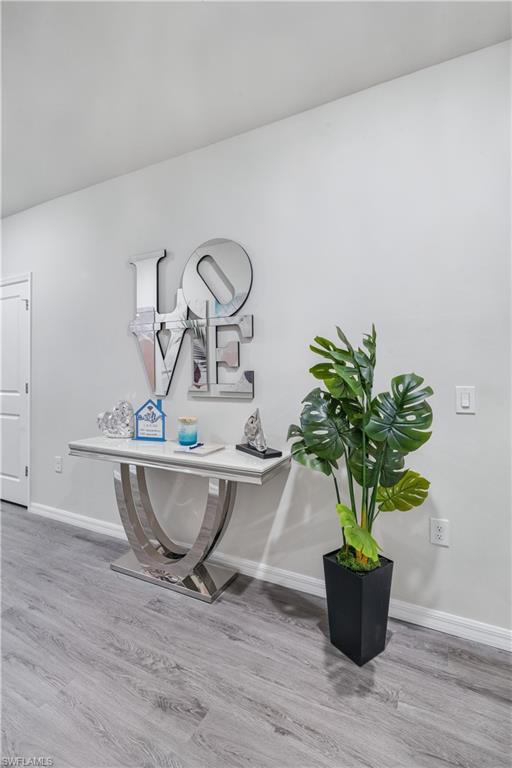 Detailed view of wood finished floors and baseboards