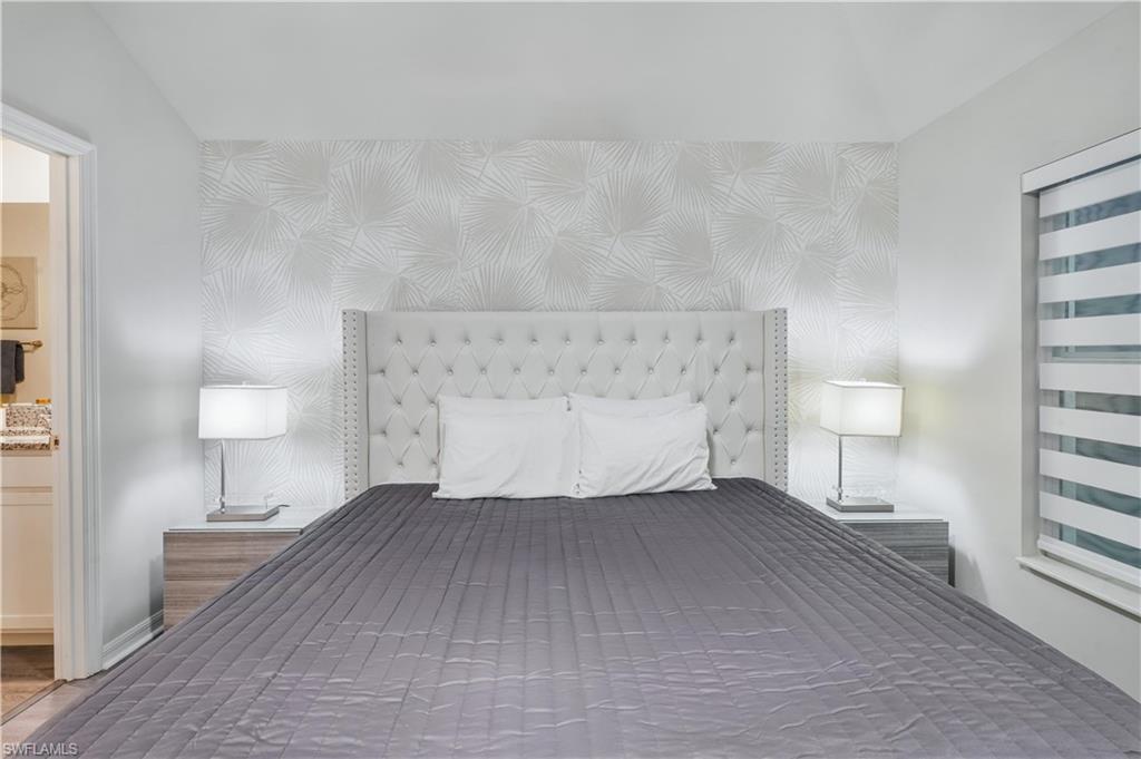 Bedroom featuring an accent wall