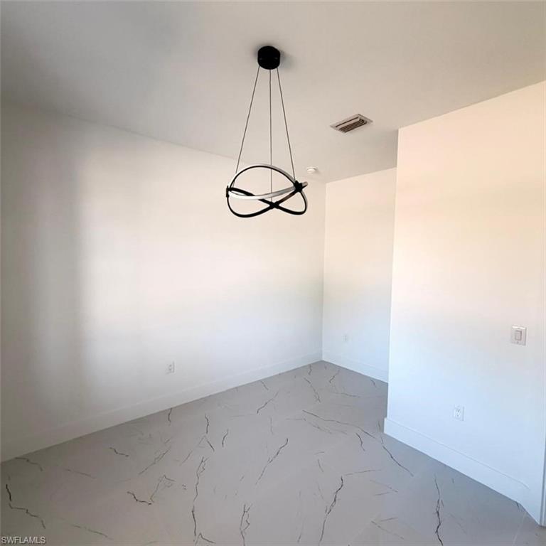 Empty room with baseboards and light marble finish flooring