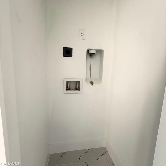 Laundry area with hookup for a washing machine and hookup for an electric dryer