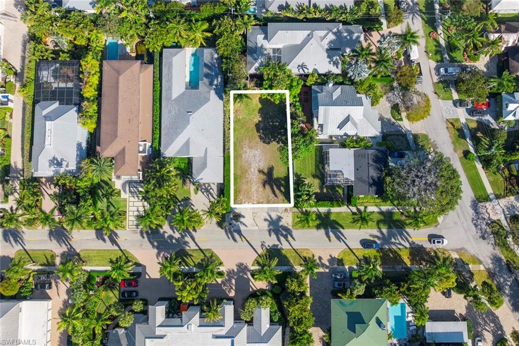 Aerial perspective of suburban area featuring property parcel outlined