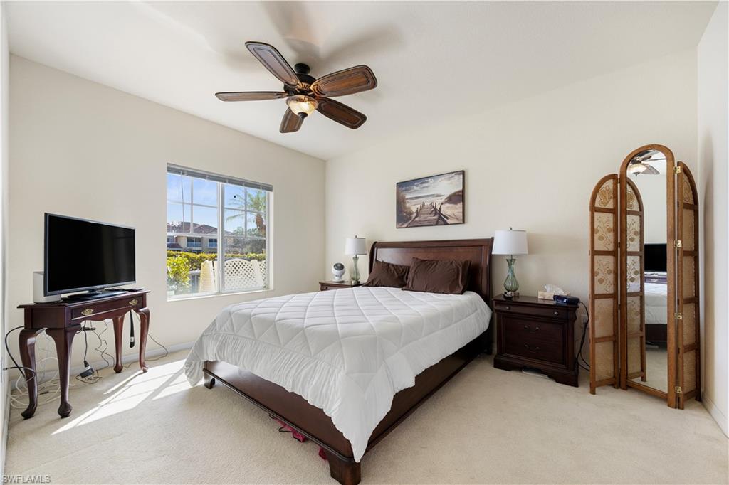 Bedroom featuring carpet and ceiling fan