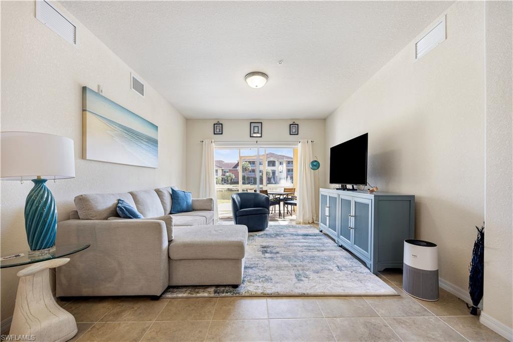 Tiled living area with a textured wall