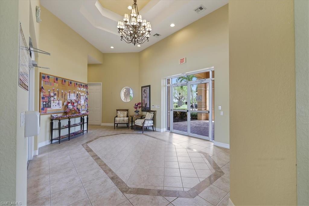 Community Building lobby with a high tray ceiling and recessed lighting