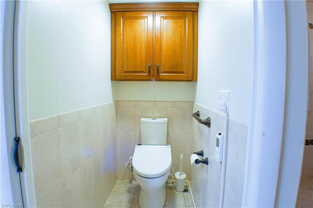 Full bath with a tile shower