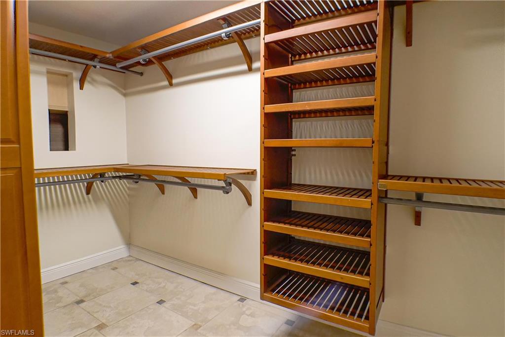 Bathroom featuring vanity, ornamental molding, and ceiling fan