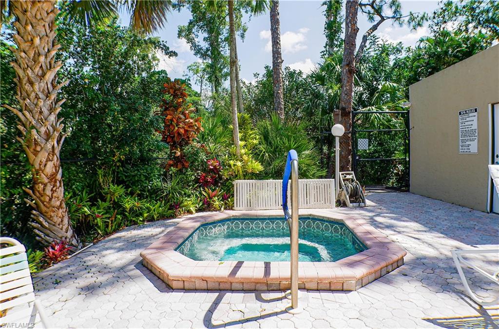 Community pool with a patio