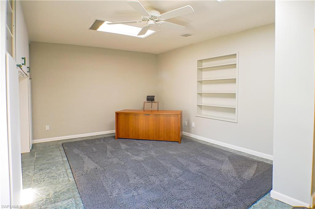 Full bath with shower / bath combination with curtain, vanity, and light tile patterned floors