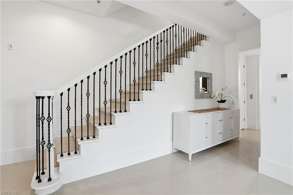 Stairway featuring tile patterned flooring