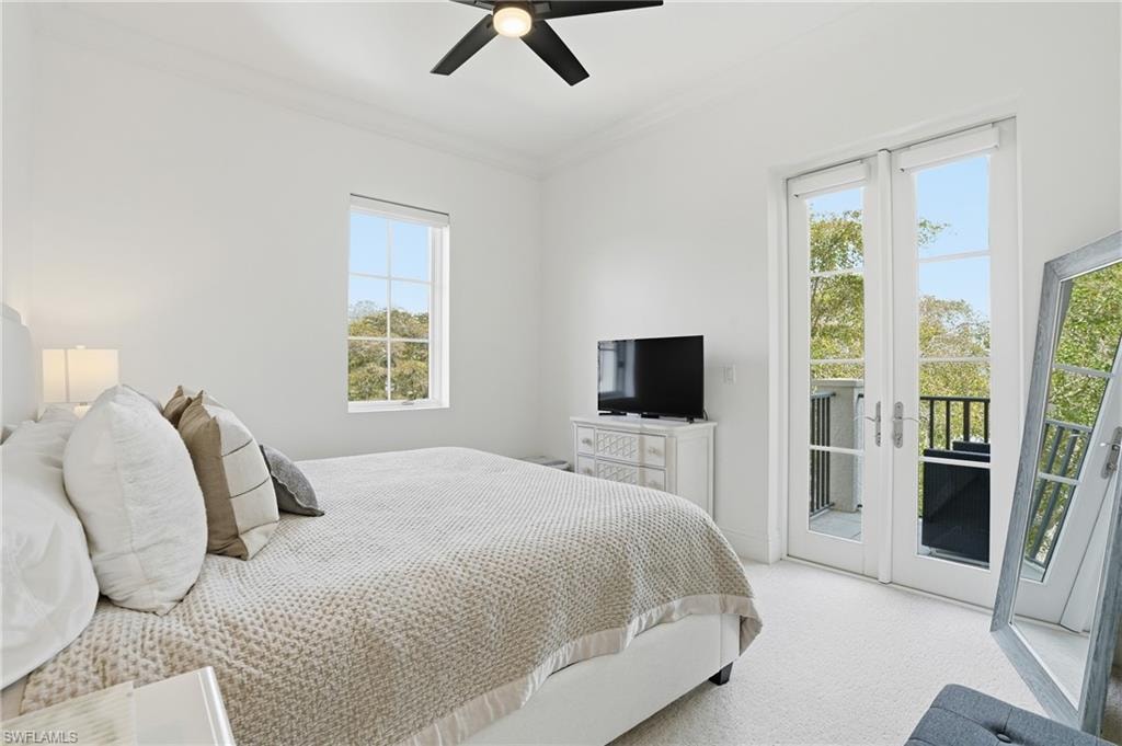 Bedroom with ornamental molding, carpet, french doors, access to exterior, and a ceiling fan