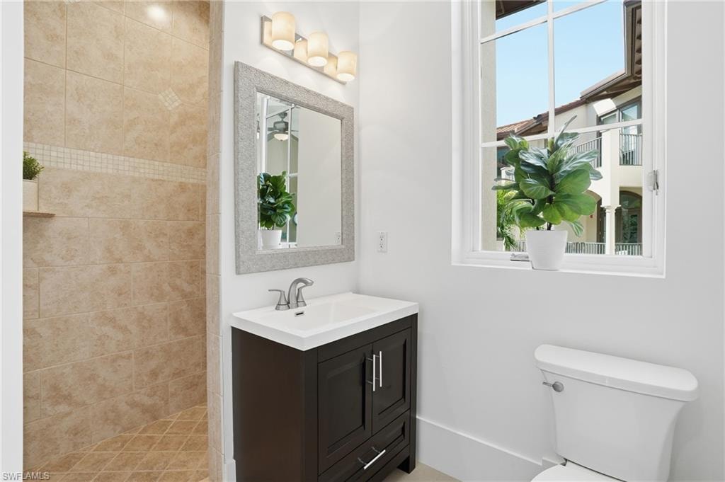 Bathroom featuring vanity and a walk in shower