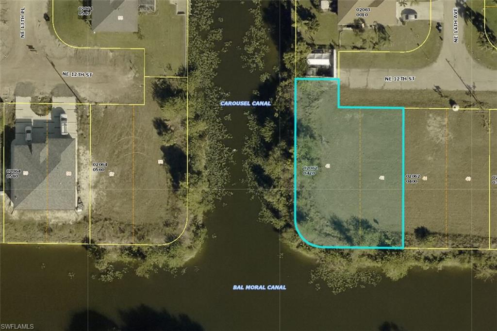Aerial overview of property's location featuring property parcel outlined