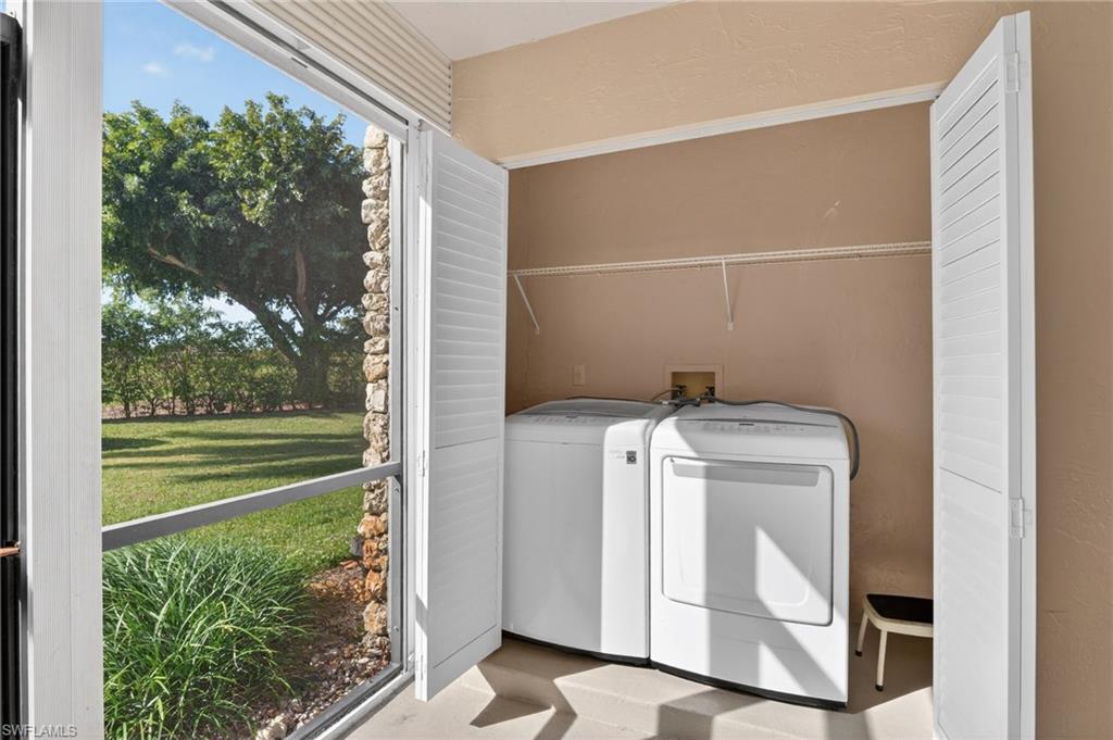 Laundry area featuring washing machine and clothes dryer