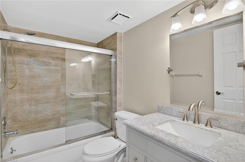 Guest Full bath with combined bath / shower with glass door and vanity
