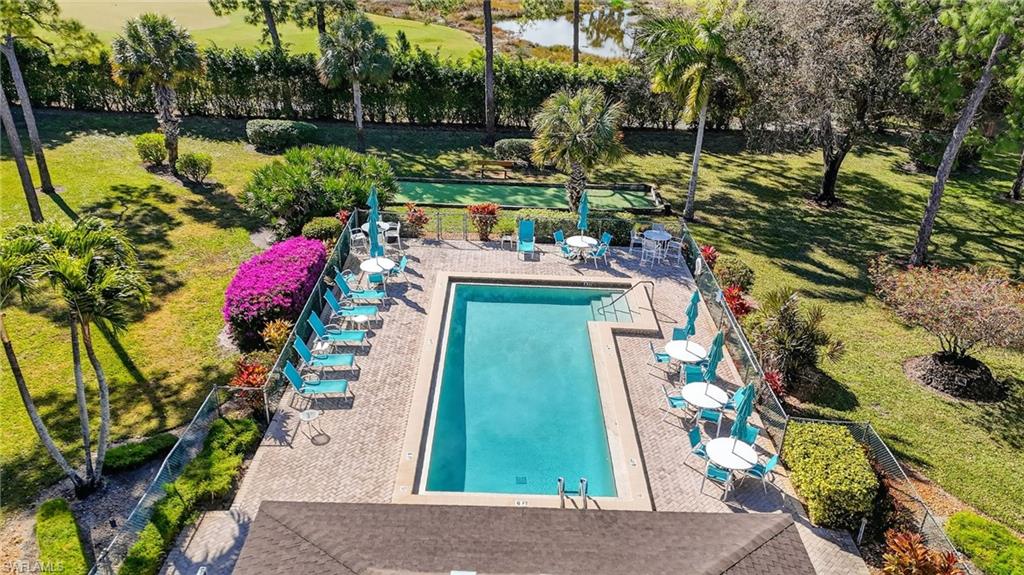 Community pool with a patio