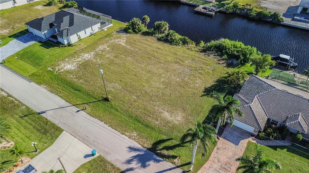 View from above of property with a nearby body of water