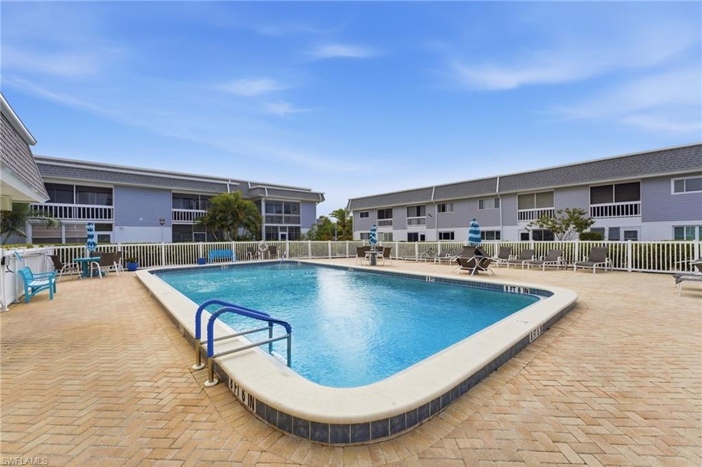 Community pool with a patio area