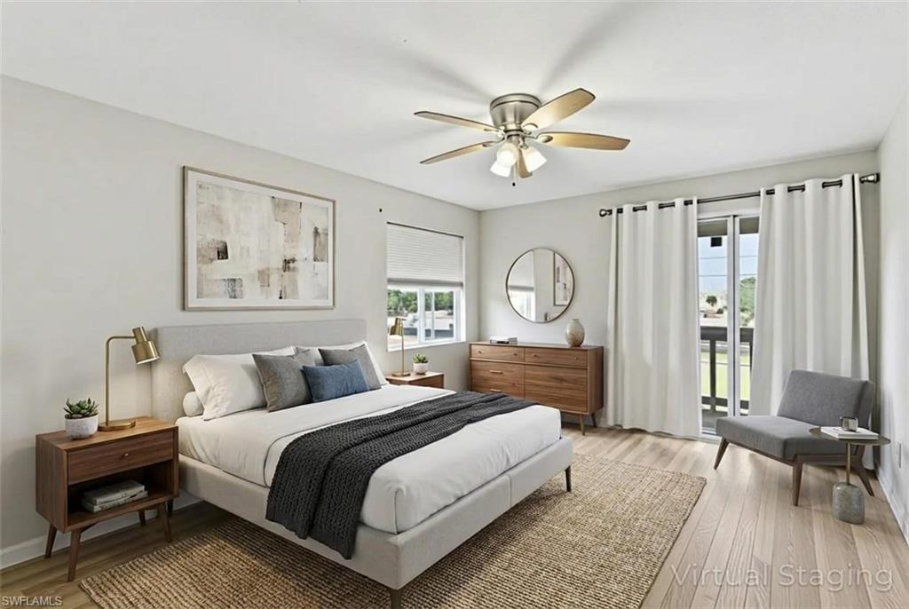 Bedroom with light wood-type flooring, access to outside, and a ceiling fan