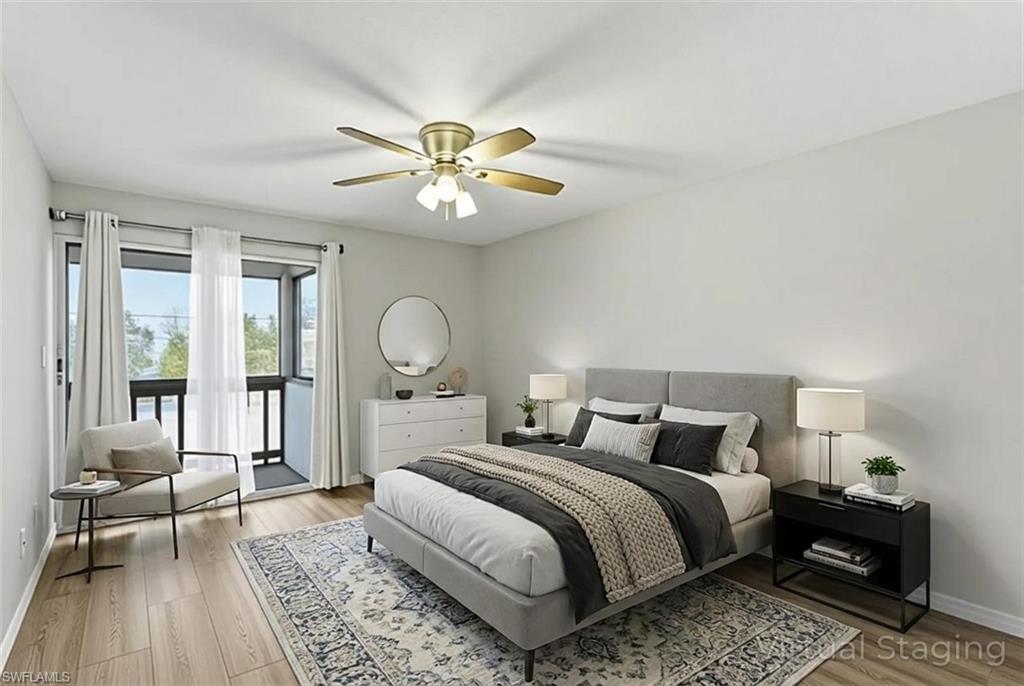 Bedroom featuring access to outside, light wood finished floors, and a ceiling fan