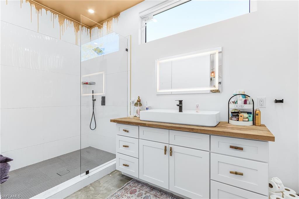 Bathroom featuring vanity and walk in shower