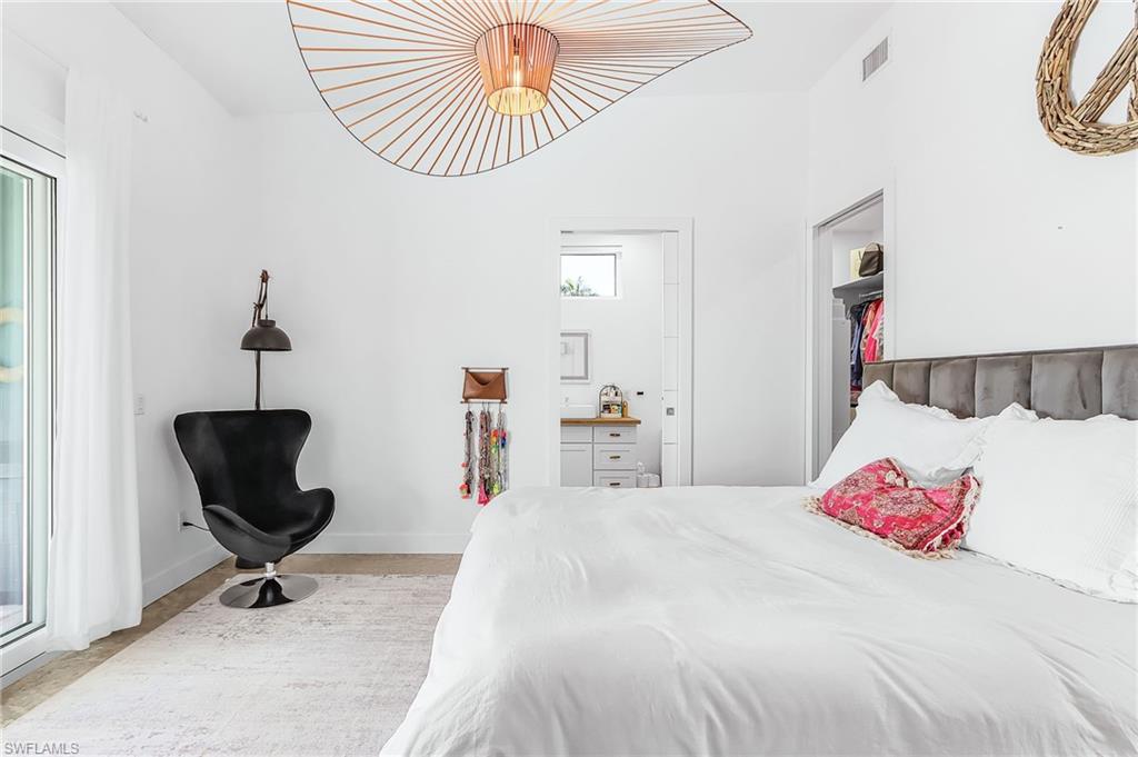 Bedroom with baseboards and access to outside