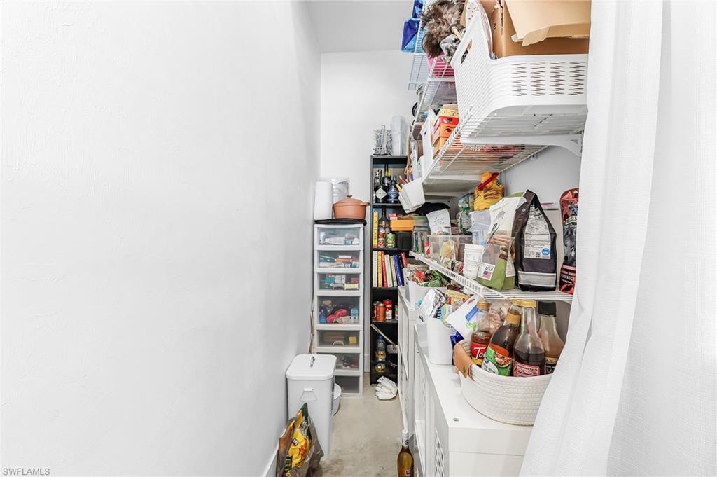 Storage area featuring washer / clothes dryer
