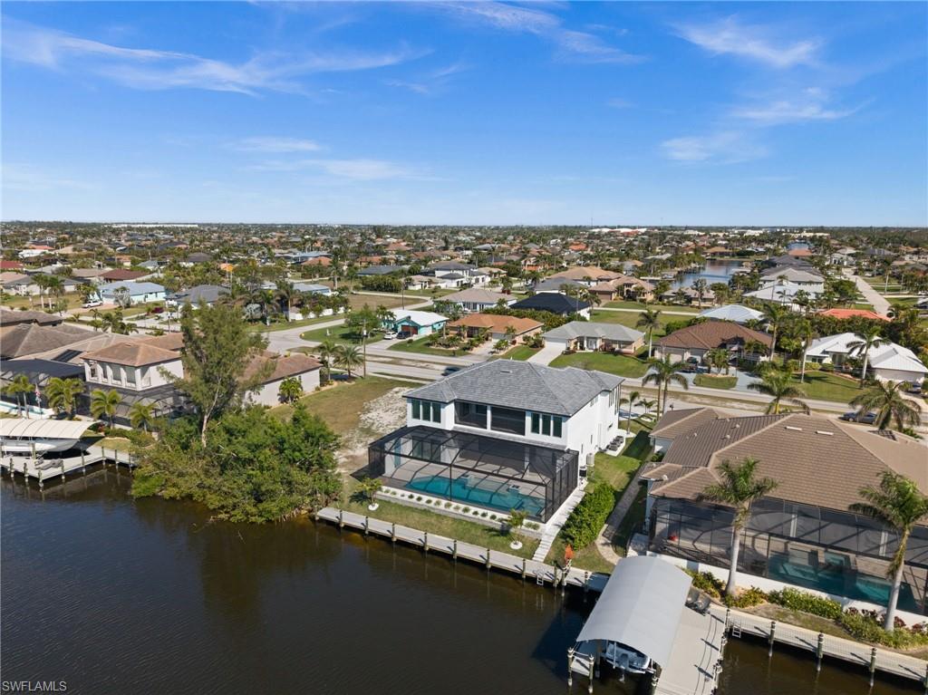 Aerial perspective of suburban area with a nearby body of water