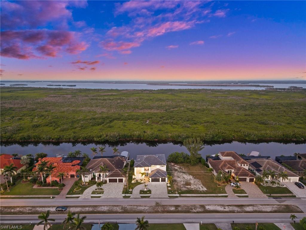 Aerial view at dusk of a residential view and a water view