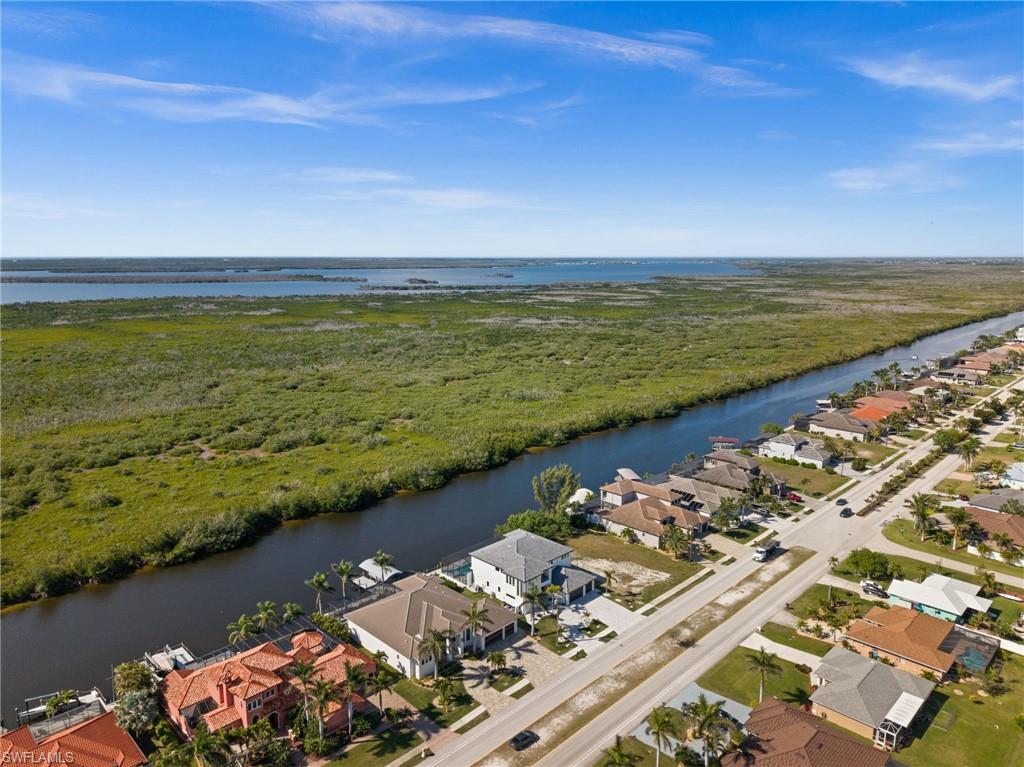 Aerial perspective of suburban area with a large body of water