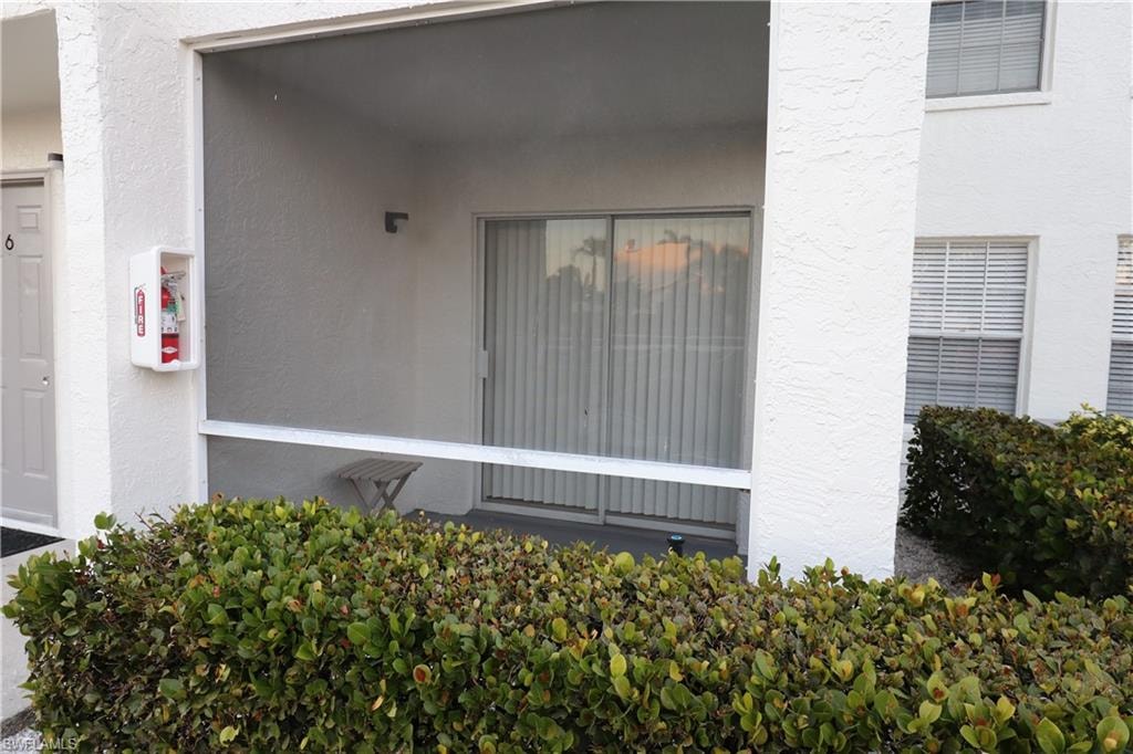 View of exterior entry featuring stucco siding