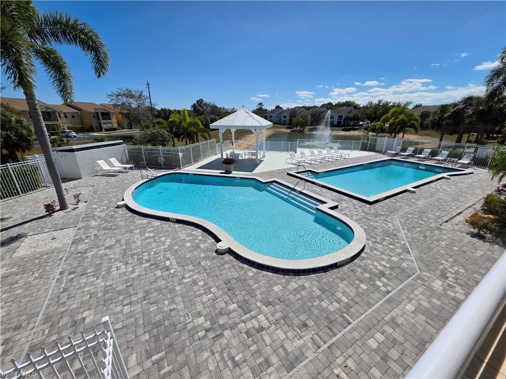 Community pool with a gazebo and a patio