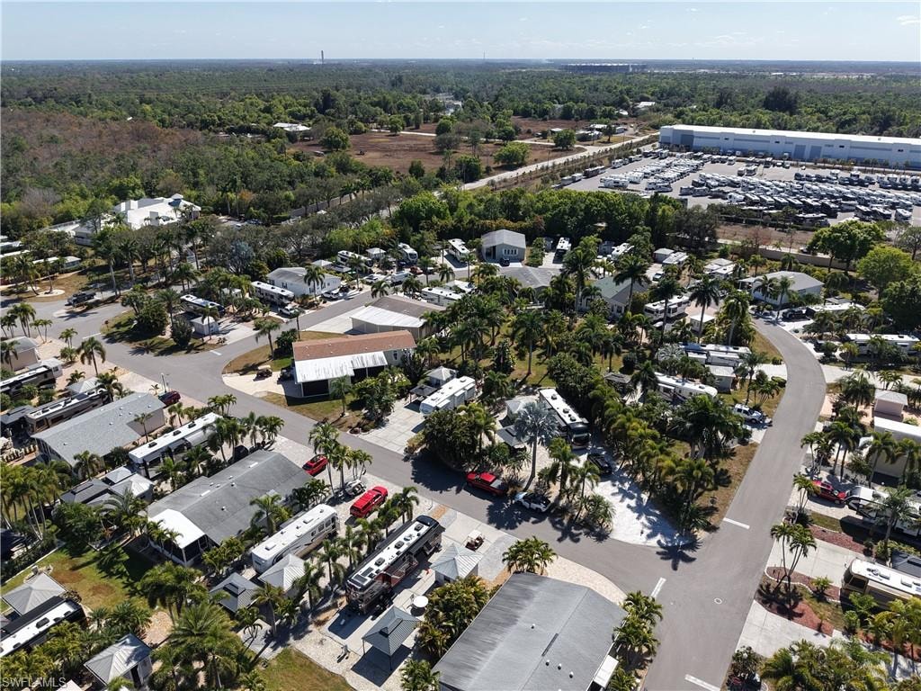 View of property location with a heavily wooded area
