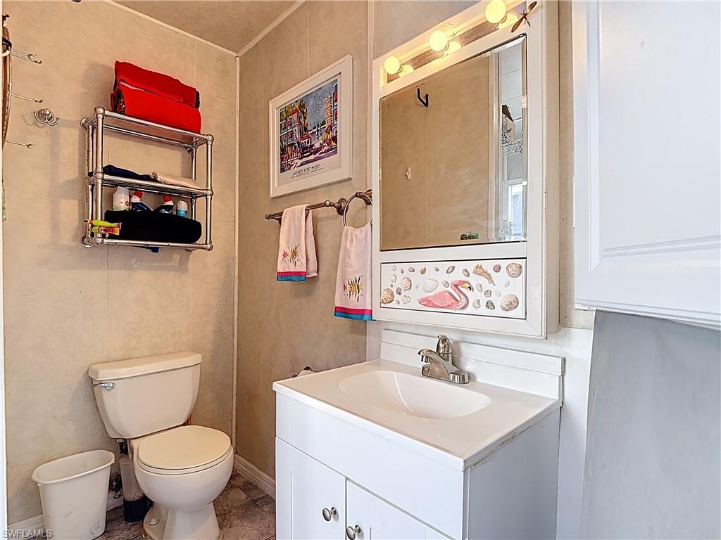 Bathroom featuring vanity and toilet