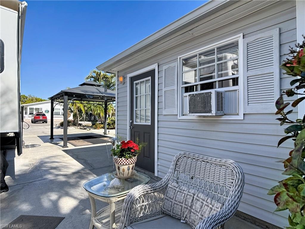 View of patio with a gazebo and cooling unit