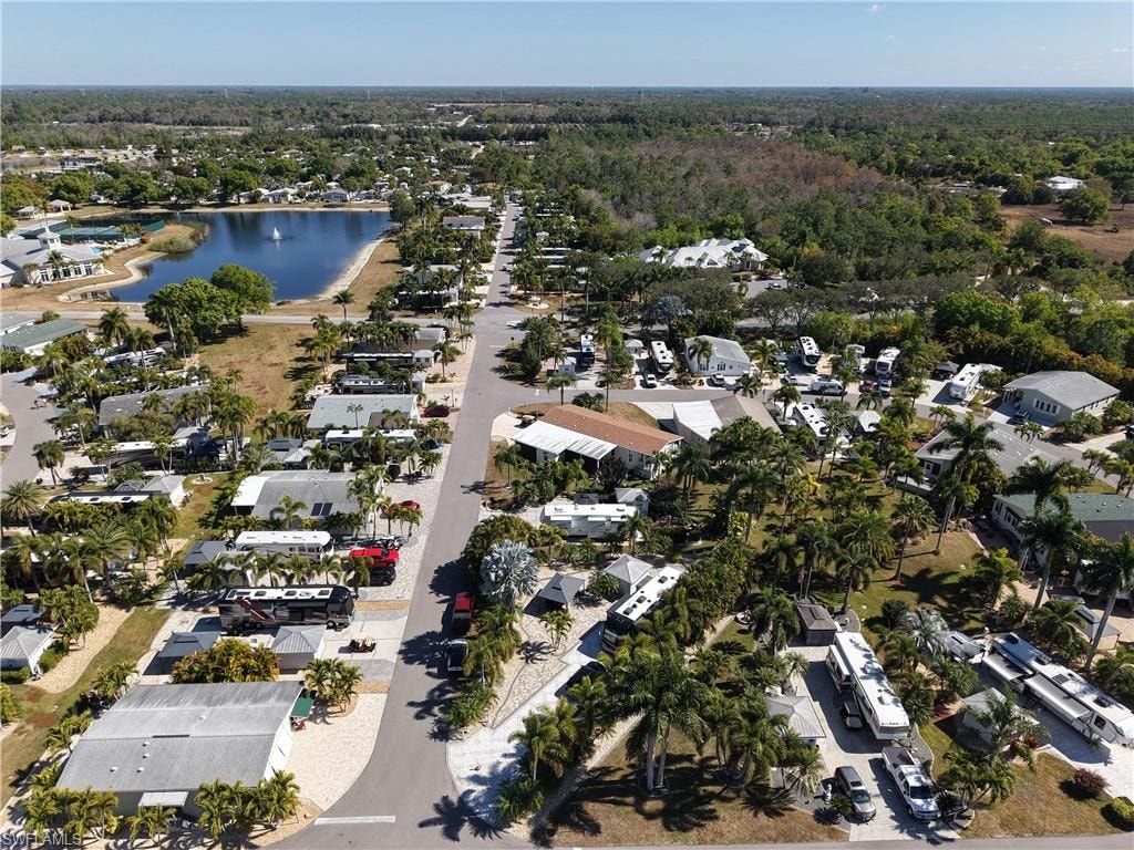 Aerial view of property's location featuring nearby suburban area and a large body of water