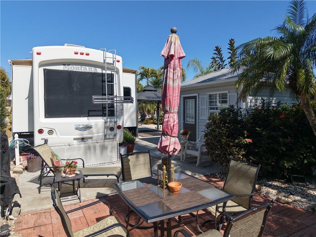 View of patio with outdoor dining space