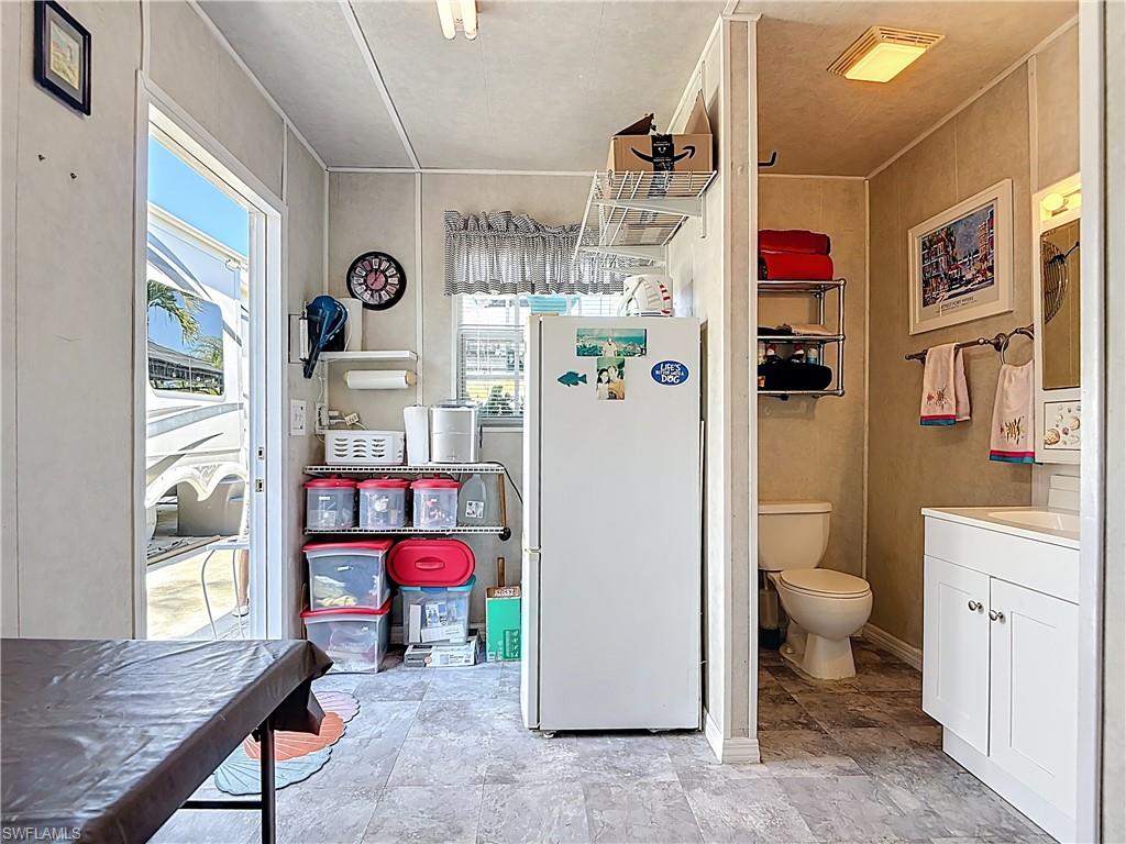 Bathroom with vanity and stone finish flooring