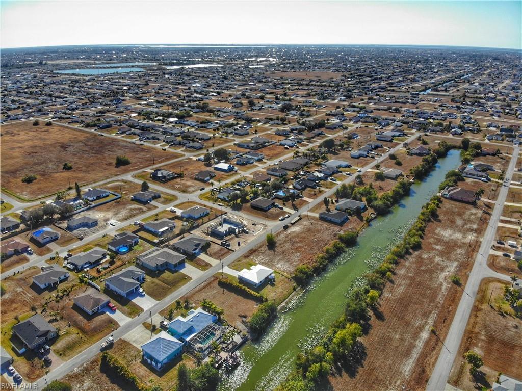 Aerial view of property's location featuring nearby suburban area
