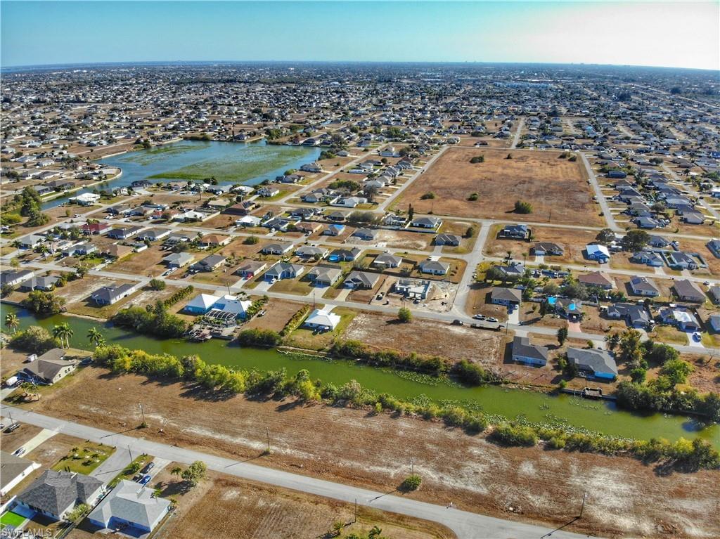 Aerial view of property's location featuring nearby suburban area