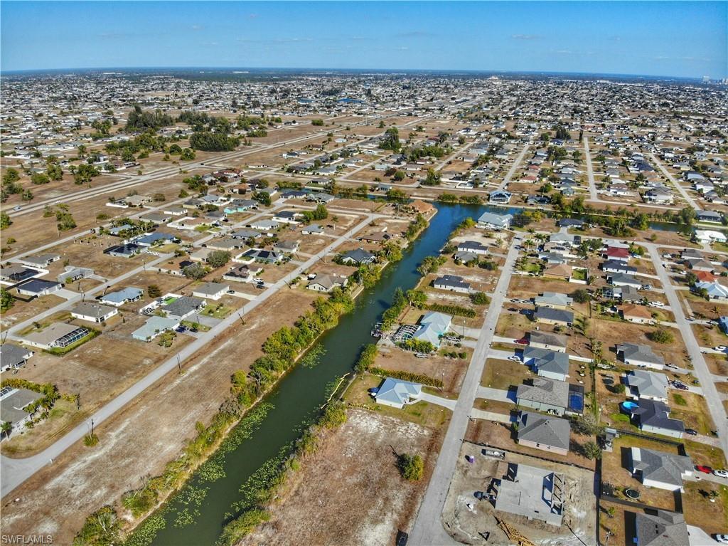 View of property location with nearby suburban area and a large body of water
