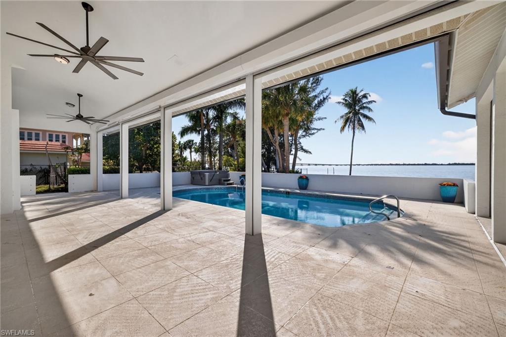 View of swimming pool featuring patio surround