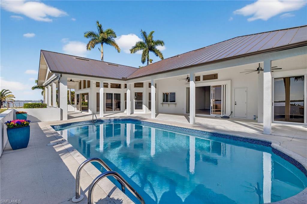View of swimming pool with patio surround