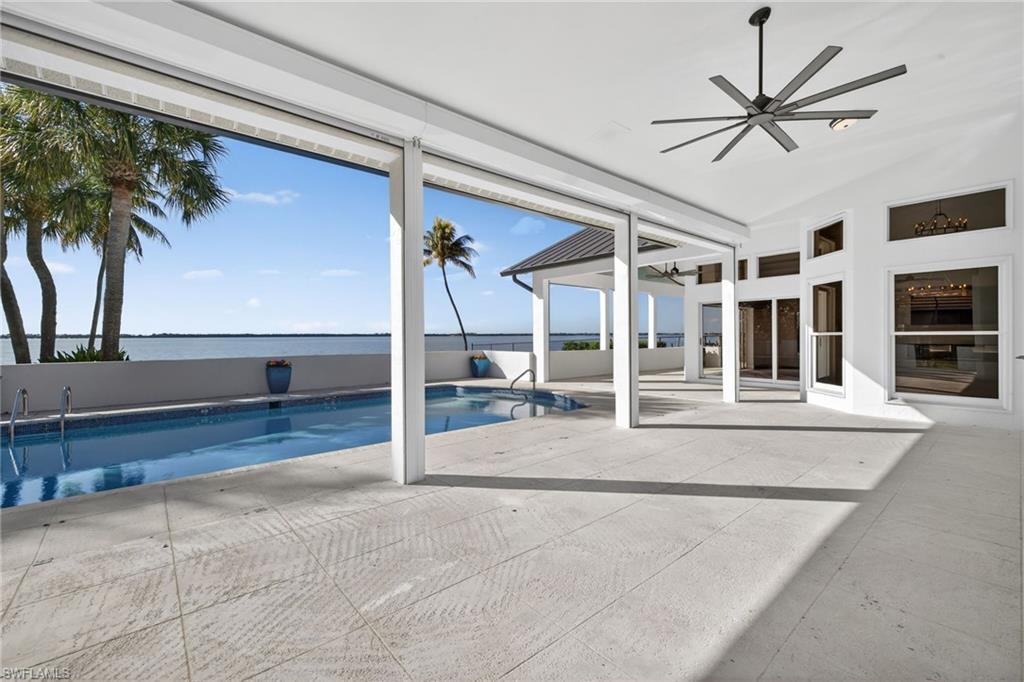 View of pool with ceiling fan
