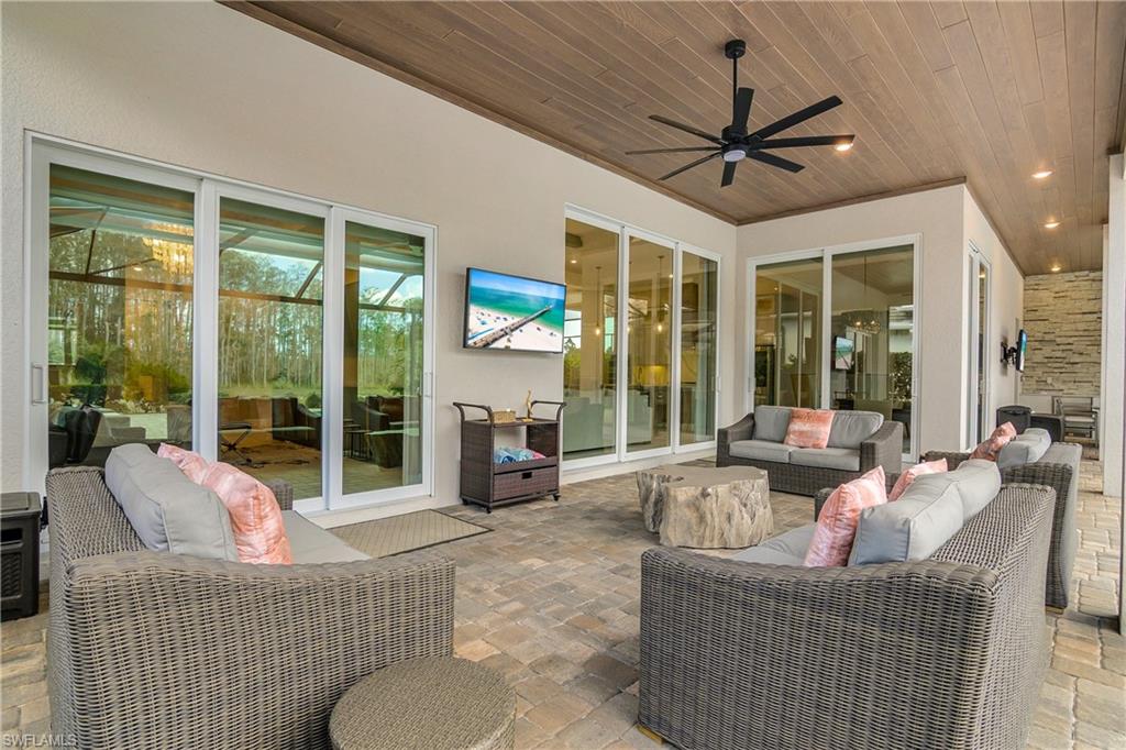 View of patio featuring an outdoor hangout area and ceiling fan
